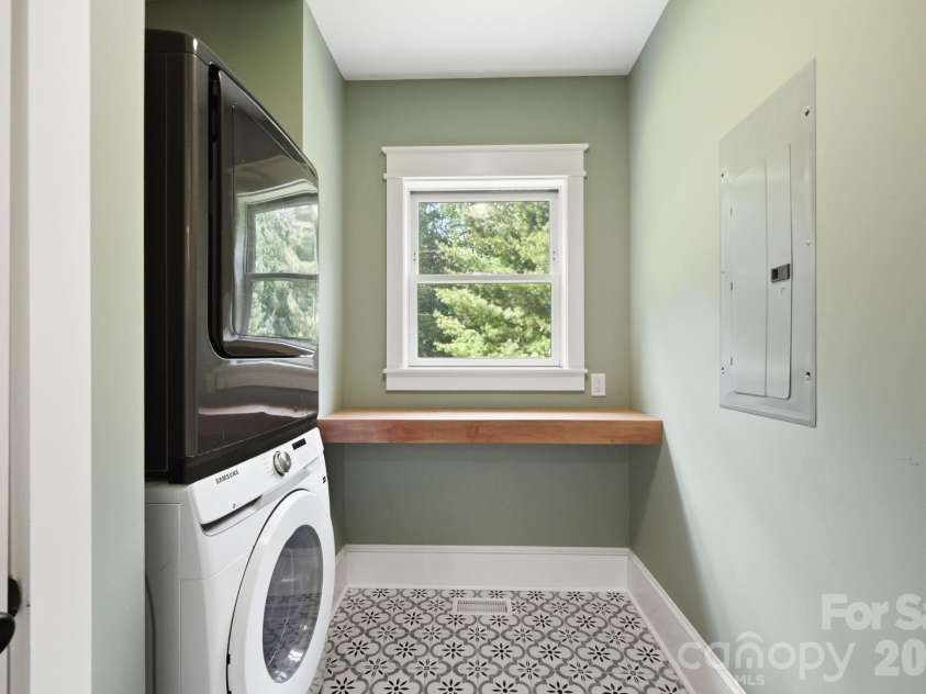 163 Walnut Drive, Jefferson, NC 28640.  MLS# CAR4420717, YatesRealty ID 48294. Main Level Laundry Room with Storage