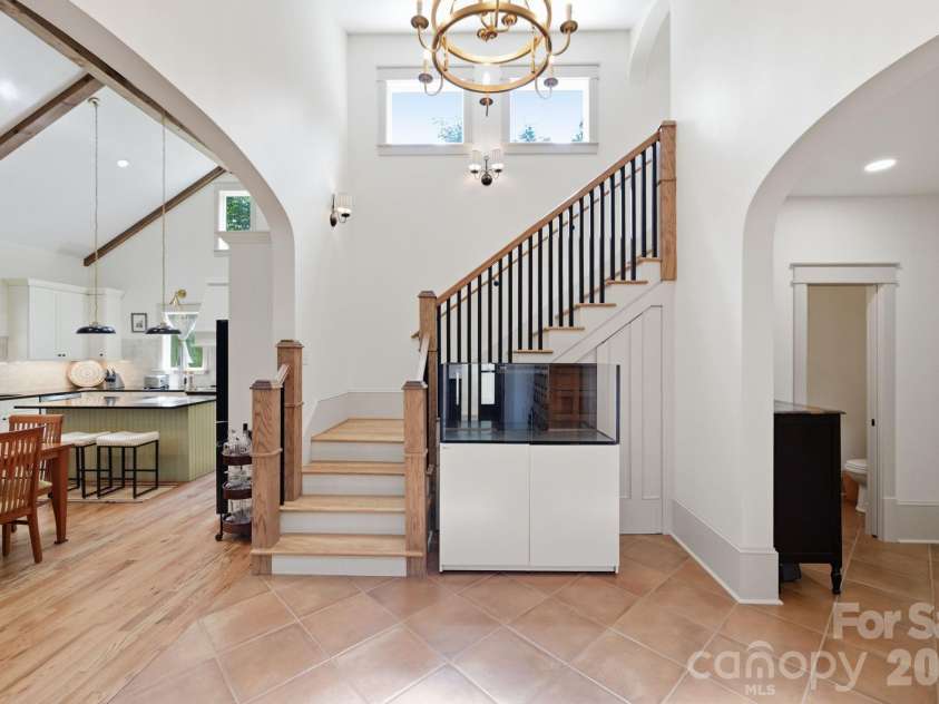 163 Walnut Drive, Jefferson, NC 28640.  MLS# CAR4420717, YatesRealty ID 48294. Storage area under staircase behind decorative trim