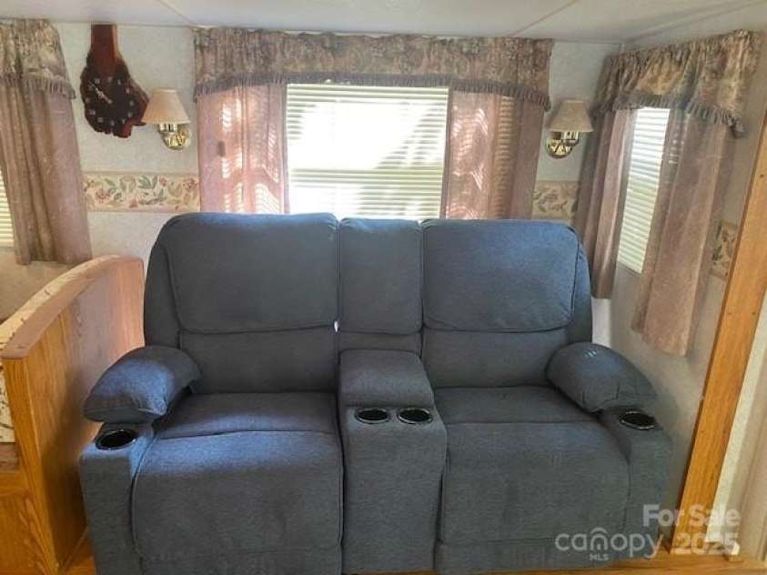 582 Dogwood Circle, Traphill, NC 28685.  MLS# CAR4238397, YatesRealty ID 4832. Reclining loveseat