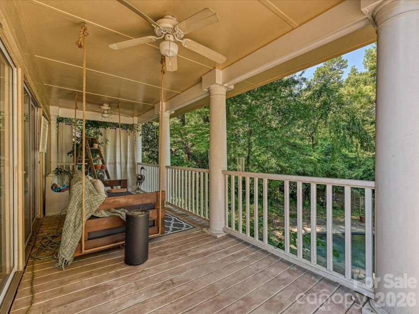 1538 Sterling Road, Charlotte, NC 28209.  MLS# CAR4420144, YatesRealty ID 48329. Covered Deck Overlooking Pool and Private Backyard
