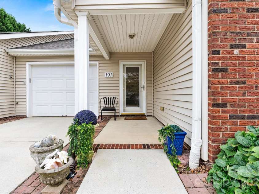 191 Oak Village Parkway, Mooresville, NC 28117.  MLS# CAR4197215, YatesRealty ID 4835. Attached Garage and Front porch area.