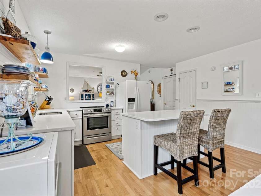 191 Oak Village Parkway, Mooresville, NC 28117.  MLS# CAR4197215, YatesRealty ID 4835. Large island with seating.