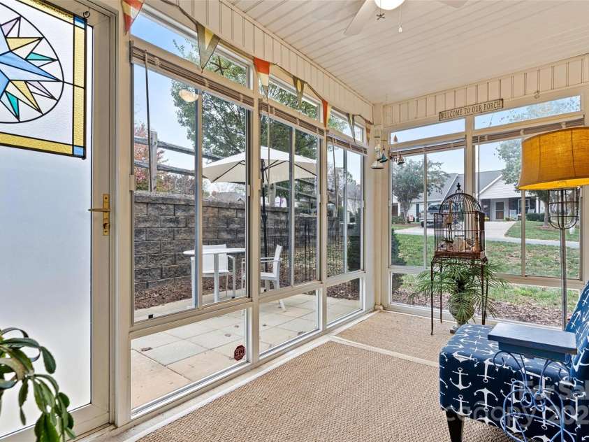 191 Oak Village Parkway, Mooresville, NC 28117.  MLS# CAR4197215, YatesRealty ID 4835. Sunroom with door to outside patio.