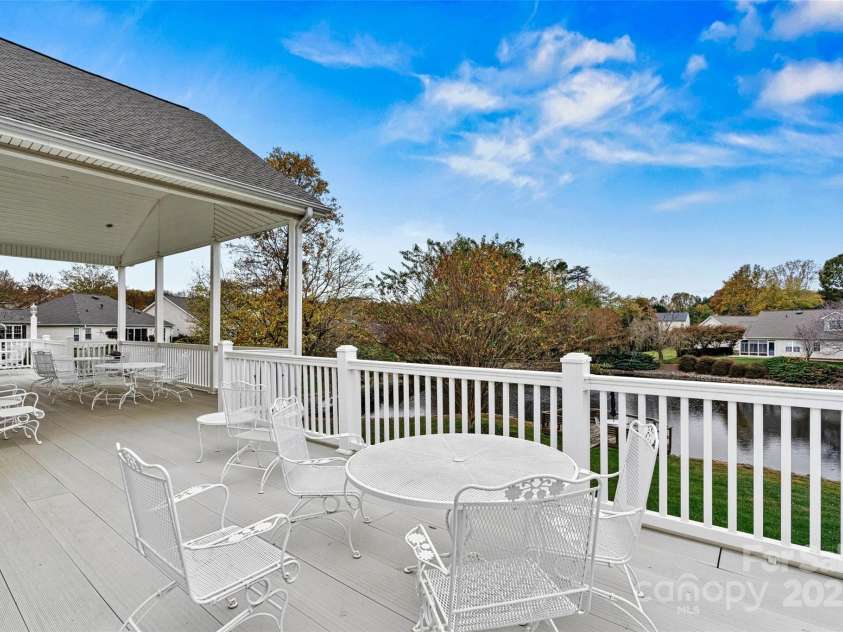 191 Oak Village Parkway, Mooresville, NC 28117.  MLS# CAR4197215, YatesRealty ID 4835. The Clubhouse has a Large Veranda and patio area that overlooks the pond.