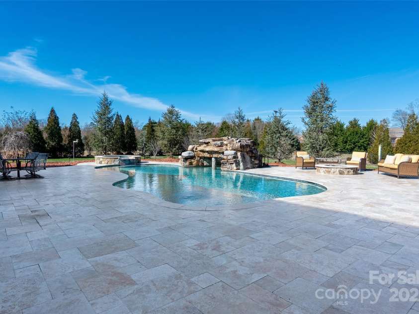 9610 Pensive Lane, Waxhaw, NC 28173.  MLS# CAR4240111, YatesRealty ID 4838. Expansive Travertine pool deck