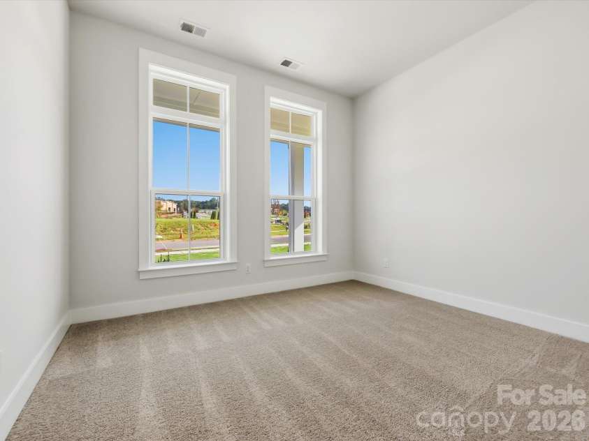 558 Cape Cod Way, Rock Hill, SC 29732.  MLS# CAR4421025, YatesRealty ID 48385. Downstairs bedroom with oversized windows