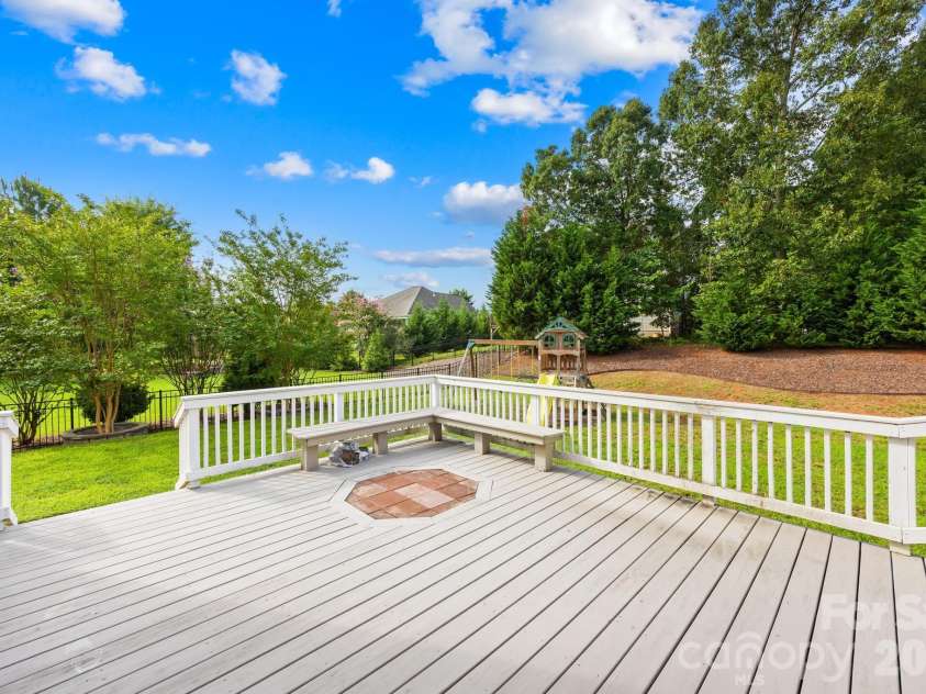 1004 Hawker Road, Matthews, NC 28104.  MLS# CAR4411741, YatesRealty ID 48396. Back deck