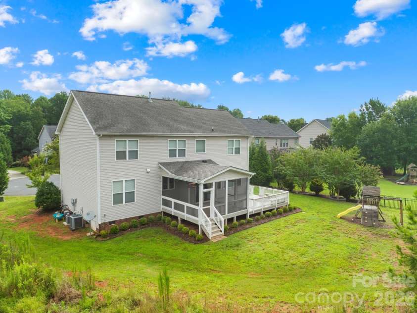 1004 Hawker Road, Matthews, NC 28104.  MLS# CAR4411741, YatesRealty ID 48396. Back view of house