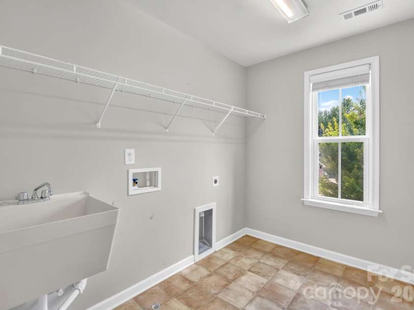 1004 Hawker Road, Matthews, NC 28104.  MLS# CAR4411741, YatesRealty ID 48396. EXTRA Large Laundry room