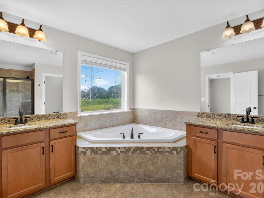 1004 Hawker Road, Matthews, NC 28104.  MLS# CAR4411741, YatesRealty ID 48396. Primary bath with dual sinks