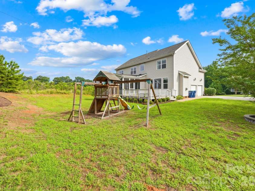 1004 Hawker Road, Matthews, NC 28104.  MLS# CAR4411741, YatesRealty ID 48396. Useable backyard
