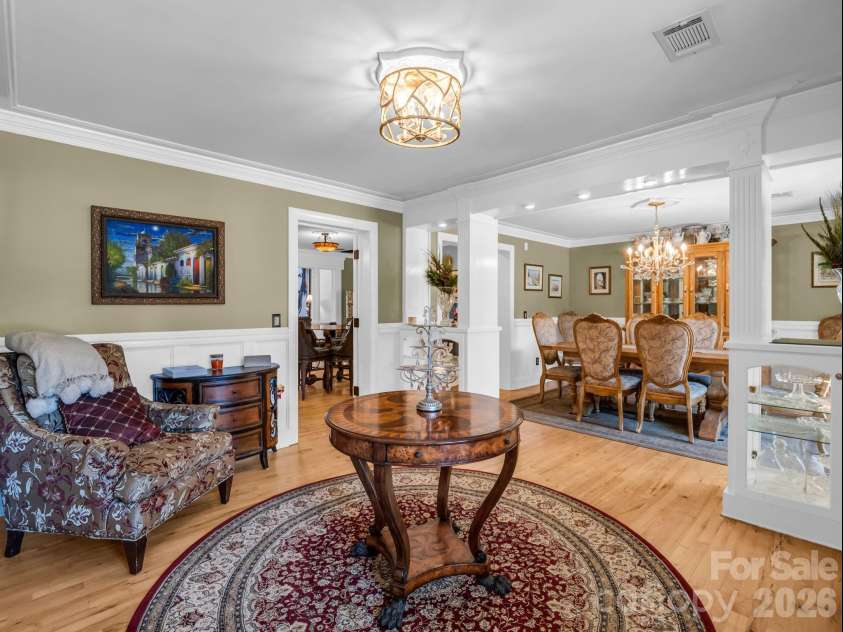 1102 Mountain Road, Bostic, NC 28018.  MLS# CAR4318780, YatesRealty ID 484. Lighted glass cabinets between front entry room & dining room