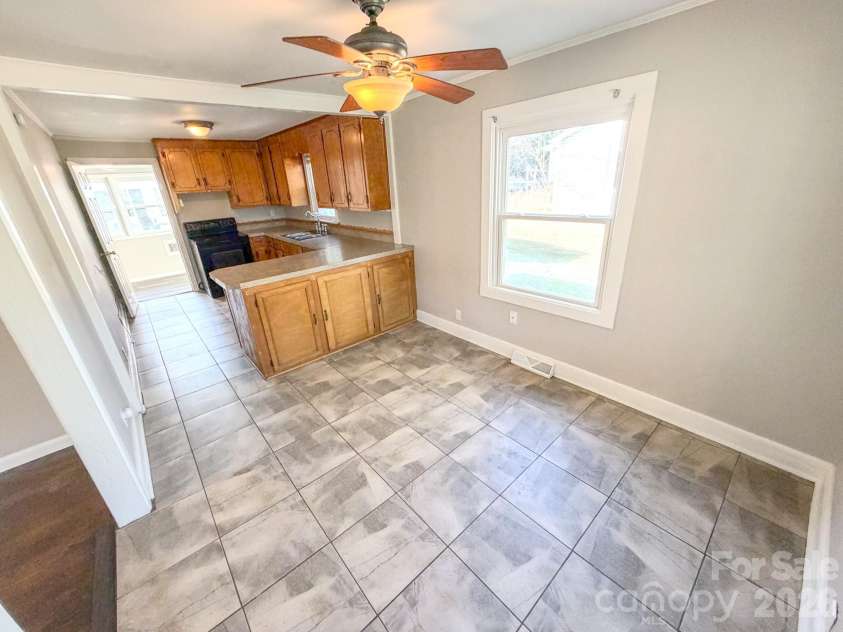 5216 Eaton Circle, Charlotte, NC 28208.  MLS# CAR4356733, YatesRealty ID 4840. Kitchen and Dining Room 