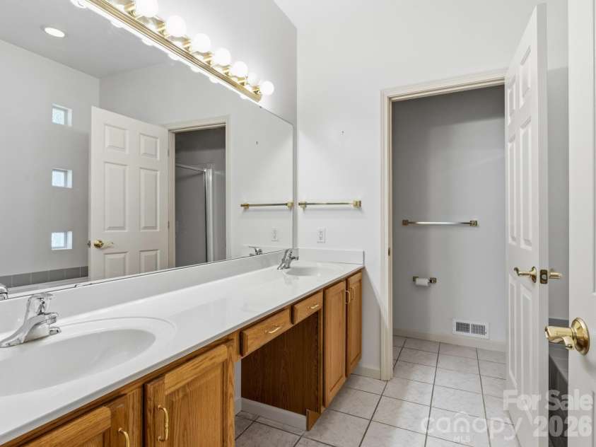 128 Stone House Road, Hendersonville, NC 28739.  MLS# CAR4420074, YatesRealty ID 48410. Primary Bath Featuring Double Vanities