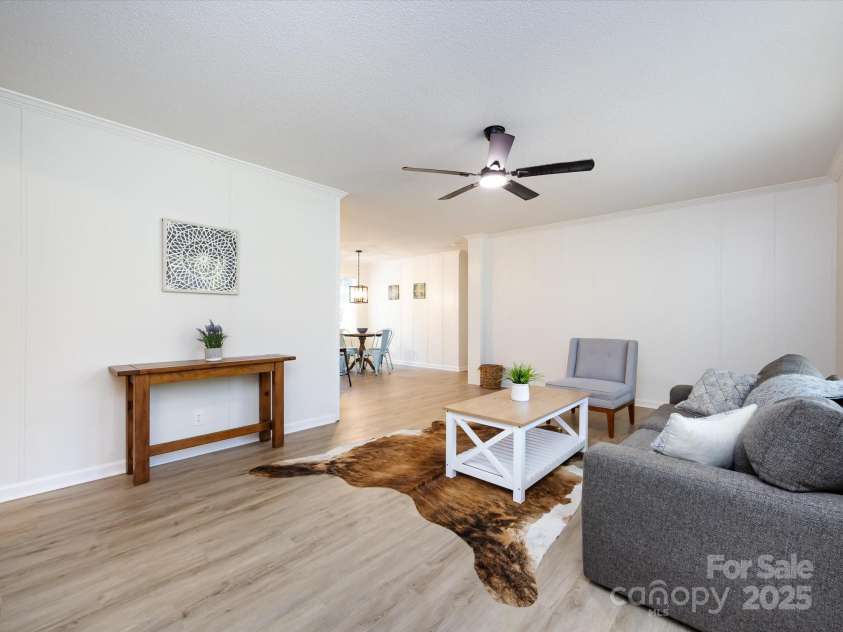 907 4th Avenue, Gastonia, NC 28054.  MLS# CAR4306590, YatesRealty ID 4842. View from entering the home of the open floor plan and living area. 