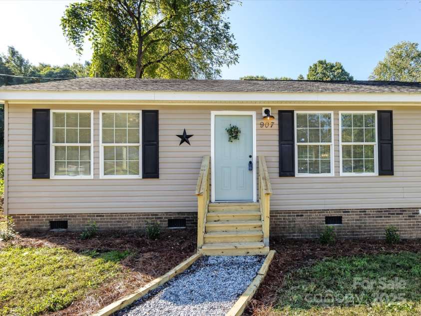 907 4th Avenue, Gastonia, NC 28054.  MLS# CAR4306590, YatesRealty ID 4842. View of front door with new staircase.