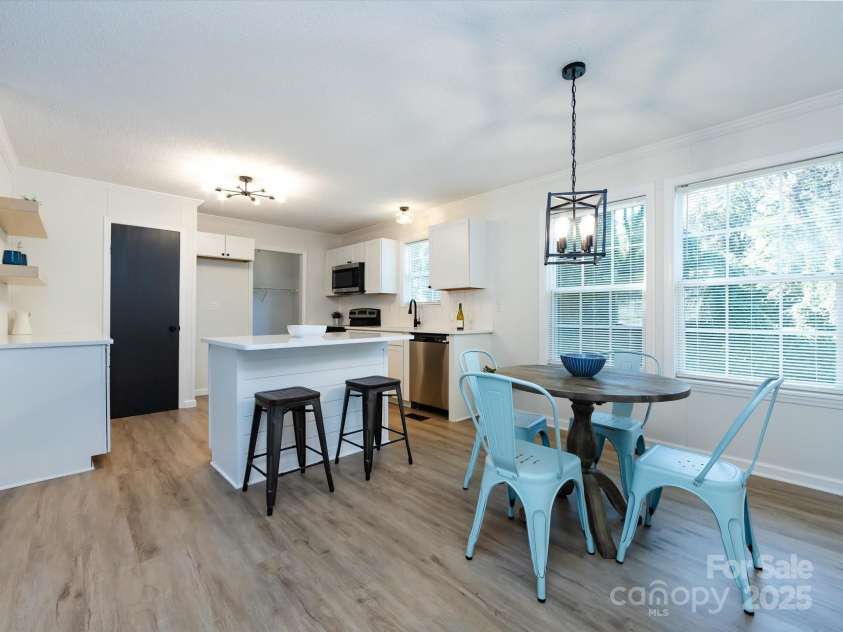 907 4th Avenue, Gastonia, NC 28054.  MLS# CAR4306590, YatesRealty ID 4842. View of kitchen with back to hallway. 