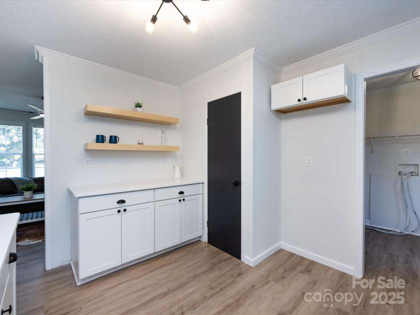 907 4th Avenue, Gastonia, NC 28054.  MLS# CAR4306590, YatesRealty ID 4842. View of kitchen with custom farm shelves, pantry closet and place for refrigerator. 