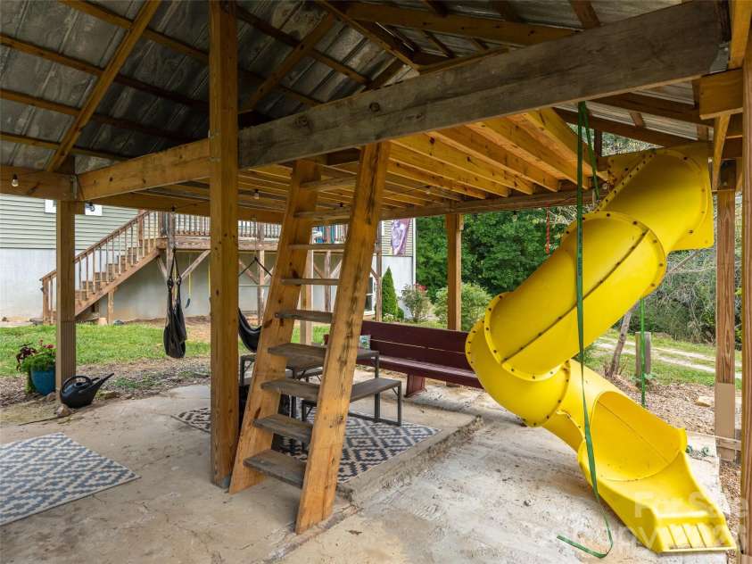 518 Onteora Boulevard, Asheville, NC 28803.  MLS# CAR4420855, YatesRealty ID 48421. Outdoor covered area currently formatted for fun space