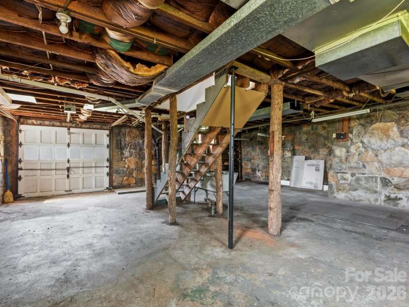 1279 Charlotte Highway, Fairview, NC 28730.  MLS# CAR4421024, YatesRealty ID 48430. Stone foundation basement