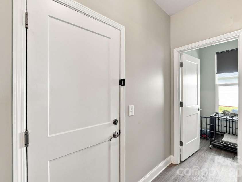 2902 Oakdale Road, Charlotte, NC 28216.  MLS# CAR4421172, YatesRealty ID 48436. Flex space off garage for drop zone, compact office, strollers, bike, etc.