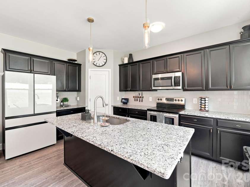 2902 Oakdale Road, Charlotte, NC 28216.  MLS# CAR4421172, YatesRealty ID 48436. Oversized island for easy prep