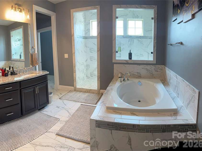 8465 Blume Parkway, Harrisburg, NC 28075.  MLS# CAR4419990, YatesRealty ID 48446. Upper Lvl. Primary Bathroom