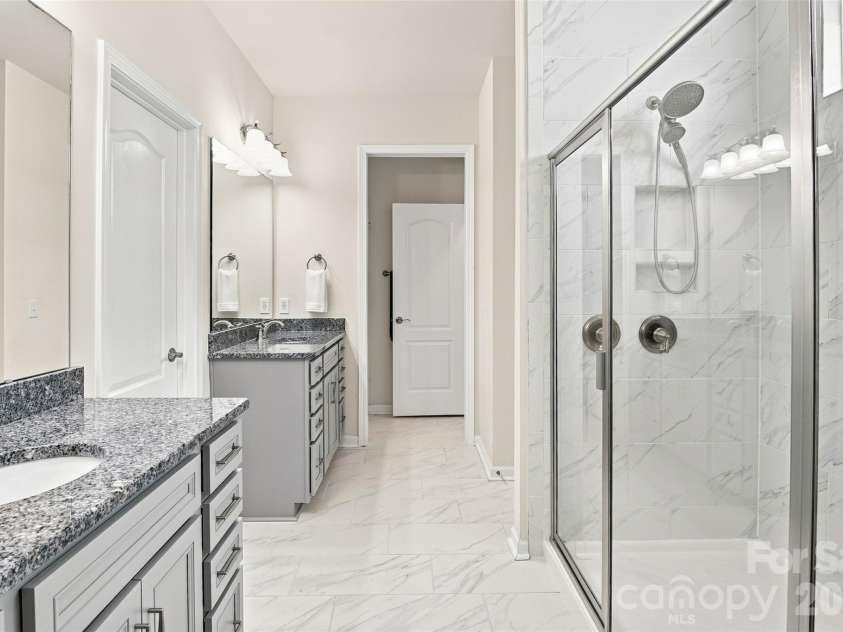 15704 Reynolds Drive, Indian Land, SC 29707.  MLS# CAR4419421, YatesRealty ID 48457. Primary bathroom with dual split vanities