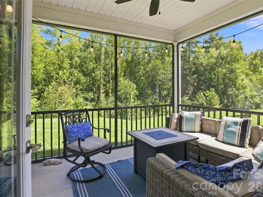 15704 Reynolds Drive, Indian Land, SC 29707.  MLS# CAR4419421, YatesRealty ID 48457. Screened in patio overlooking backyard