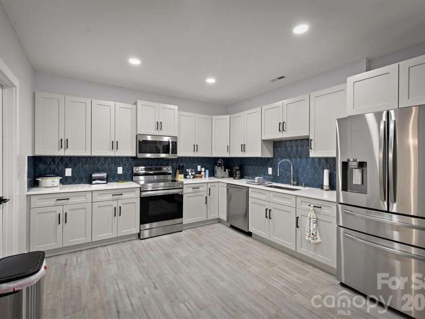 2371 Paradise Harbor Drive, Connelly Springs, NC 28612.  MLS# CAR4415547, YatesRealty ID 48470. Kitchen in basement