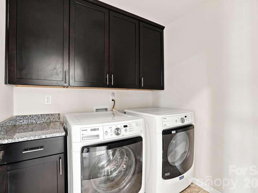 4742 Phifer Crest Court, Charlotte, NC 28226.  MLS# CAR4417441, YatesRealty ID 48482. 2nd Floor Laundry w Cabinets