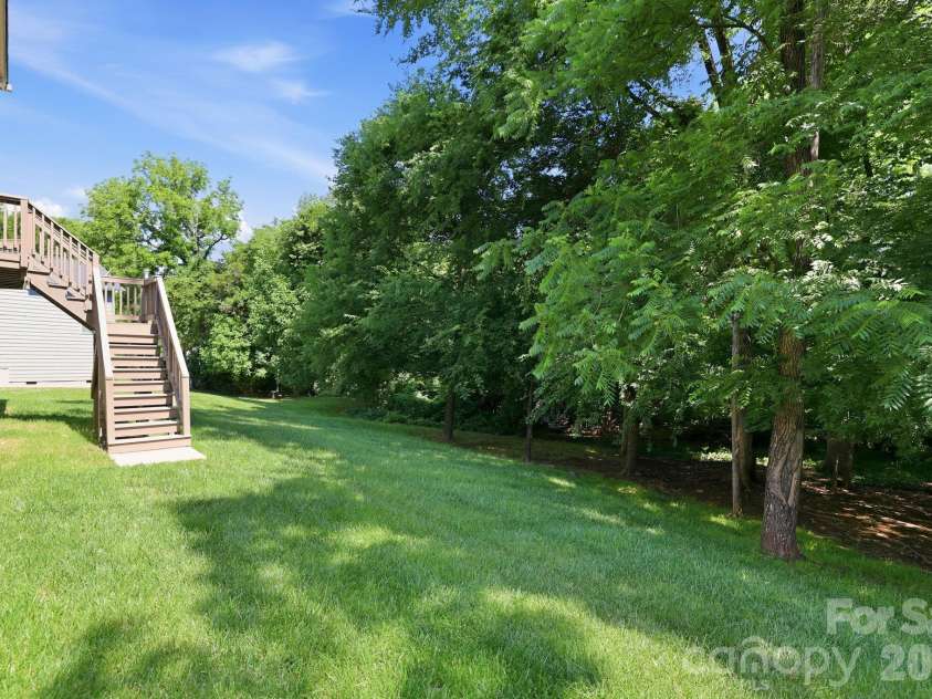 4742 Phifer Crest Court, Charlotte, NC 28226.  MLS# CAR4417441, YatesRealty ID 48482. Partially Wooded Yard