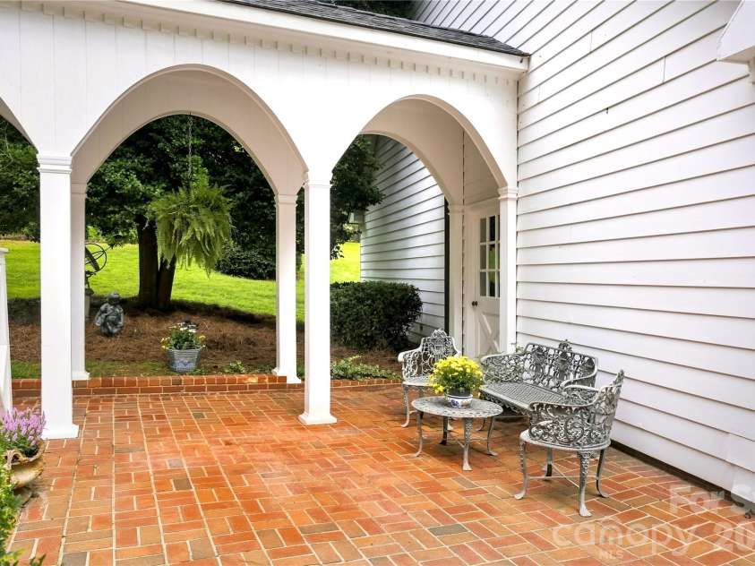 209 Labans Lane, Lincolnton, NC 28092.  MLS# CAR4419321, YatesRealty ID 48497. Arched covered breezeway connecting the home and garage.