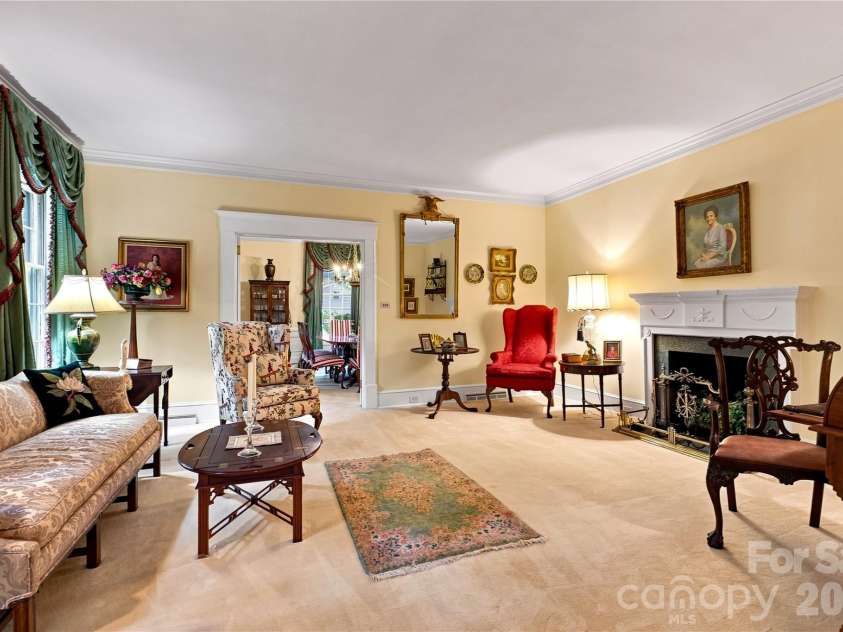 209 Labans Lane, Lincolnton, NC 28092.  MLS# CAR4419321, YatesRealty ID 48497. Formal living room with natural light and a decorative fireplace.