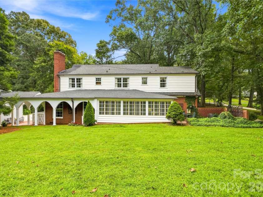 209 Labans Lane, Lincolnton, NC 28092.  MLS# CAR4419321, YatesRealty ID 48497. Rear exterior view across the expansive lawn.