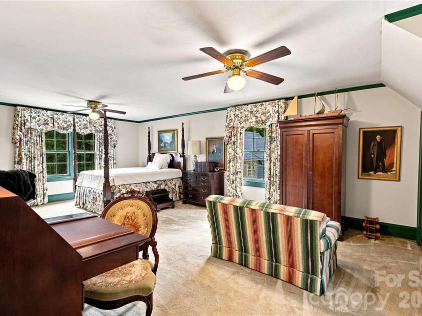 209 Labans Lane, Lincolnton, NC 28092.  MLS# CAR4419321, YatesRealty ID 48497. Spacious upper-level primary bedroom with dormer windows and sitting space.