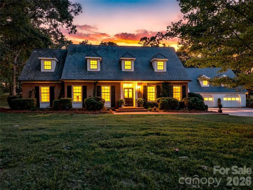 209 Labans Lane, Lincolnton, NC 28092.  MLS# CAR4419321, YatesRealty ID 48497. Twilight exterior highlighting the home’s timeless presence.