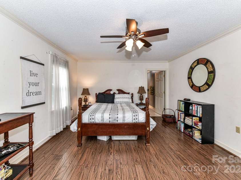 208 Eastwood Drive, Salisbury, NC 28146.  MLS# CAR4177195, YatesRealty ID 4850. Spacious Primary Bedroom on main level with crown molding, ceiling fan/light & private bath!