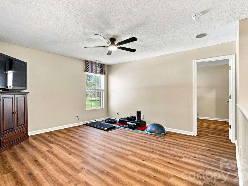 117 Farm Springs Drive, Mount Holly, NC 28120.  MLS# CAR4417237, YatesRealty ID 48501. Flexible loft for relaxing, working or exercising
