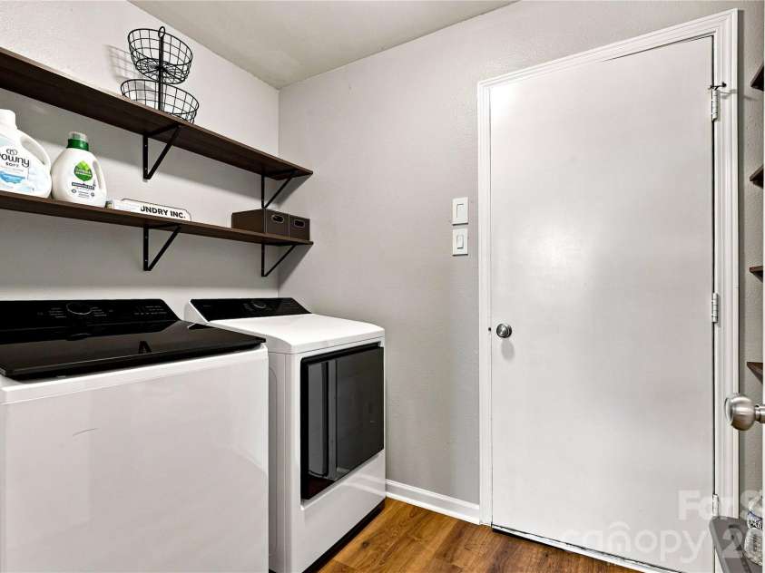 117 Farm Springs Drive, Mount Holly, NC 28120.  MLS# CAR4417237, YatesRealty ID 48501. Main level laundry room with additional shelving
