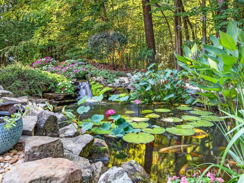 6653 Goose Point Drive, Denver, NC 28037.  MLS# CAR4421155, YatesRealty ID 48509. Expansive Koi Pond