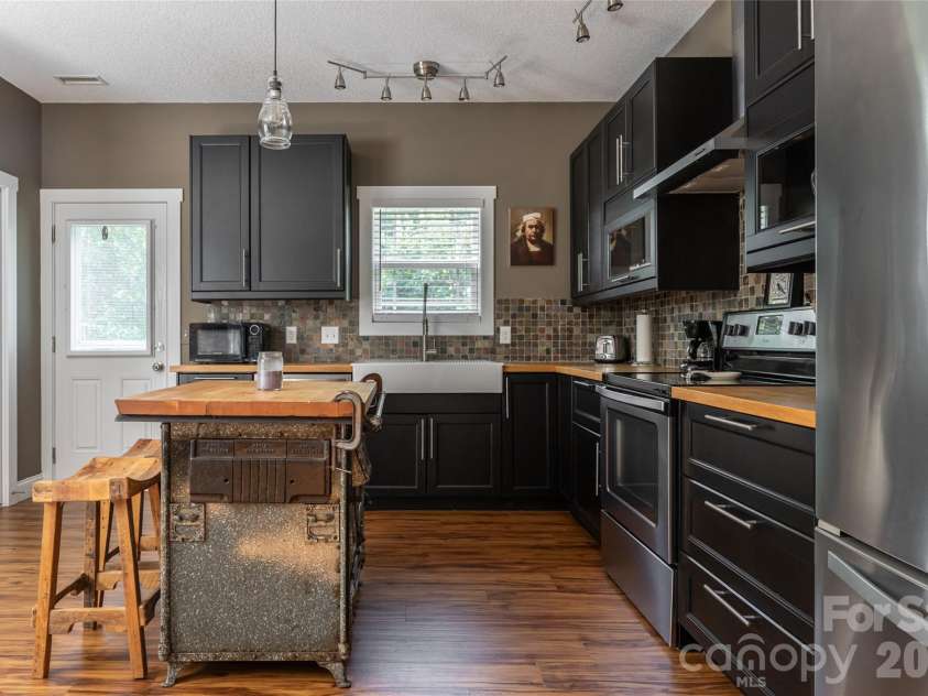 2 Mill Creek Loop, Asheville, NC 28806.  MLS# CAR4420217, YatesRealty ID 48511. Beautiful kitchen, Butcher block counters, stainless appliances