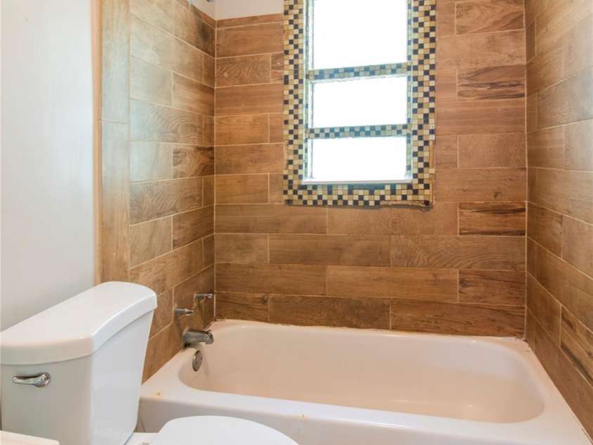 1812 Catherine Simmons Avenue, Charlotte, NC 28216.  MLS# CAR4420162, YatesRealty ID 48529. Rear unit bathroom
