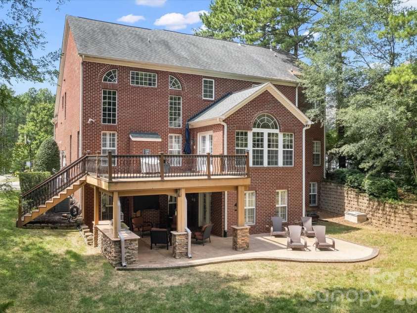 309 Stonewater Bay Lane, Mount Holly, NC 28120.  MLS# CAR4416321, YatesRealty ID 48538. Backyard Patio & Deck View