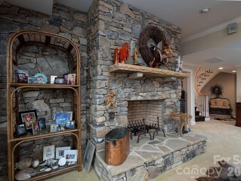117 Whitley Mill Road, New London, NC 28127.  MLS# CAR4358547, YatesRealty ID 4857. Basement Fireplace