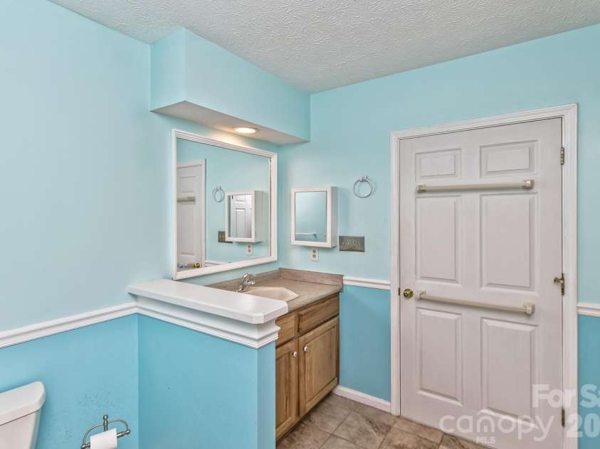 111 Sunny Ridge Drive, Asheville, NC 28804.  MLS# CAR4421169, YatesRealty ID 48587. Lower level bathroom