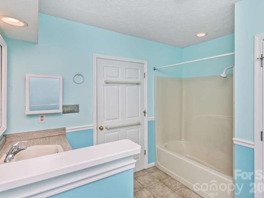 111 Sunny Ridge Drive, Asheville, NC 28804.  MLS# CAR4421169, YatesRealty ID 48587. Lower level bathroom