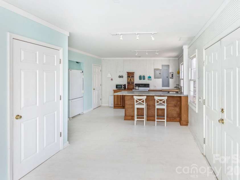 111 Sunny Ridge Drive, Asheville, NC 28804.  MLS# CAR4421169, YatesRealty ID 48587. Lower level kitchen and dining area