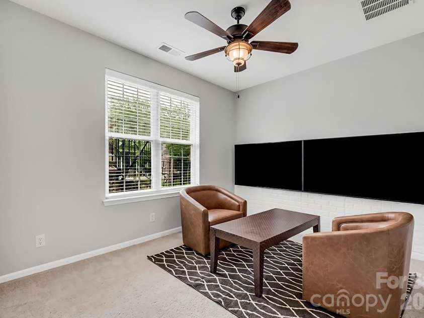 927 Lyndley Drive, Fort Mill, SC 29708.  MLS# CAR4420322, YatesRealty ID 48589. Lower Bedroom AI Generated