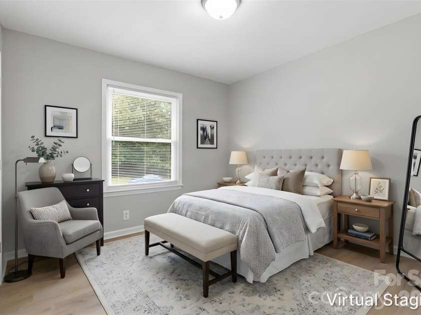 5233 Delivau Drive, Charlotte, NC 28215.  MLS# CAR4420867, YatesRealty ID 48592. Walking into the first bedroom (virtually staged & enhanced).